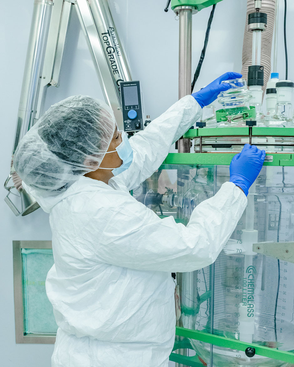 Staff working on a machine at Dalton Pharma’s state-of-the-art manufacturing facilities.